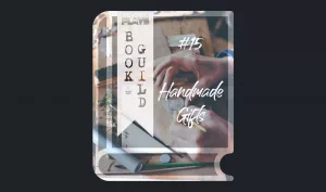 A book icon with a photo that shows an art desk with art utensils and the hands of a human who's crafting a sigil/stamp for a letter. Photo by Annie Spratt from Unsplash. A bookmark on the left side of the book, with the Pending Plays logo at the top and "Book Guild" in vertical format below. On the right of the book it says "#15 Handmade Gifts" in a bold font with dripping liquid.
